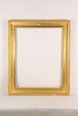 an empty picture frame sitting on top of a white shelf