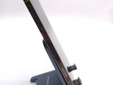 a close up of a cell phone on a stand