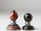 pair of salt and pepper shakers on a white surface