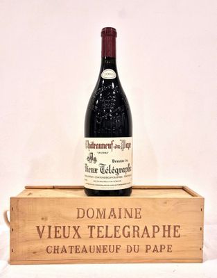 a bottle of wine sitting on top of a wooden box