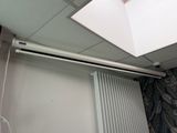 a white radiator in a room with a skylight above it