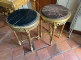 two tables that are sitting on a tiled floor