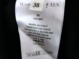 an image of a label on a black shirt with a white tag