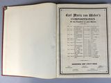 an open book on a table with a list of items in it