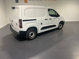 a picture of a white van parked in a garage