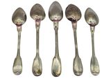 six spoons are lined up in a row on a white surface
