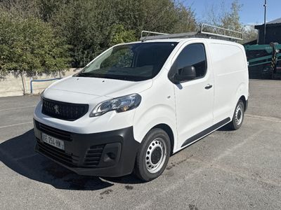 a white van that is parked in a parking lot