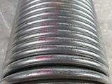 a close up of a metal pipe with a hole in the middle