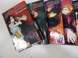 three covers of manga books sitting on a white surface