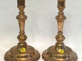 pair of antique brass candlesticks with floral decoration on each end