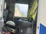 a van that has been vandalized and is parked on the side of the road