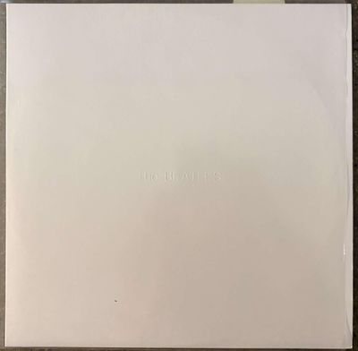 an open white box with a logo on it sitting on top of a table