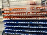 many bins that are on the shelves in the store