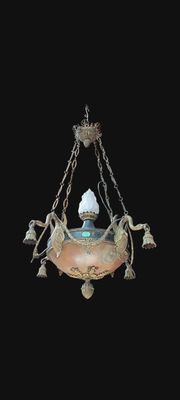 a light hanging from a chandelier in a dark room