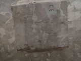 a cement block on the wall of a bathroom