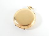 an image of a gold pocket watch with a chain on a white background