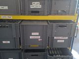 many boxes stacked on top of each other in a room