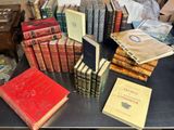 a lot of books on a table in a room