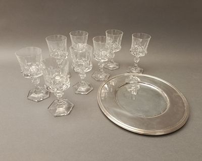 many glasses and a silver plate on the table