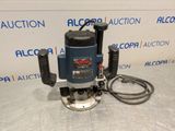 a blue and black electric router sitting on top of a table