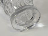 a glass jar with a lid on a white surface