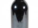 a bottle of wine that is sitting on a table