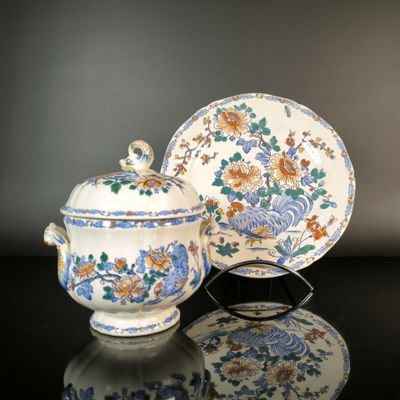 an image of a blue and white bowl and saucer on a table