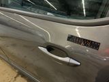 a car door handle with a sticker on it