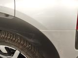 a close up of a car tire with a cat on it