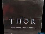 the box for thor is sitting on a black surface