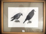 two black birds sitting on top of a wooden table next to each other