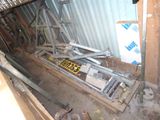 a pile of construction equipment sitting in the corner of a room