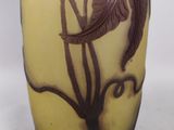a vase with a design of a flower on it