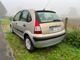 a small car that is parked on the side of the road