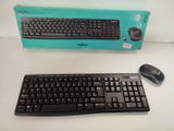 a computer keyboard and a mouse on a table