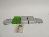three tins of tins sitting on a table next to each other