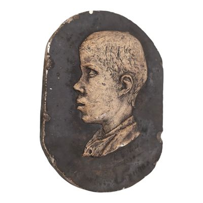 an old picture of a young boy in a black and gold frame