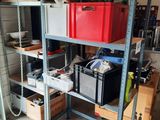 many boxes and boxes on the shelves in the garage
