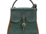 a green and brown handbag on a white background
