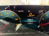 a close up of a car dashboard with a speedometer and gauges