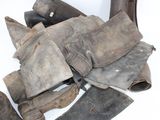 a pile of old boots that have been left on the ground