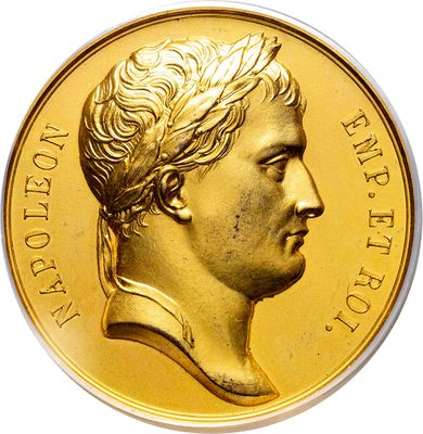 gold coin with a portrait of a woman in profile
