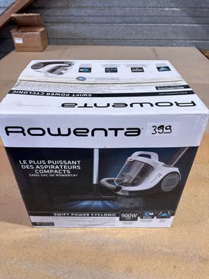 the box of a vacuum cleaner is sitting on the table