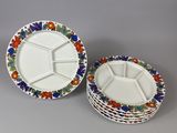 three plates with different designs are stacked on top of each other