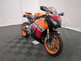 a motorcycle that is sitting on the floor in the room