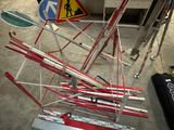 a pile of skis and ski poles on the ground