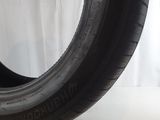 tire tread of a car on a white surface with a white background