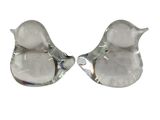 two glass birds sitting on top of each other