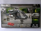 the box is open to show the contents of a lego army helicopter