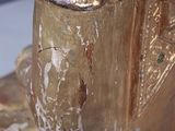 a close up of a gold statue of a horse